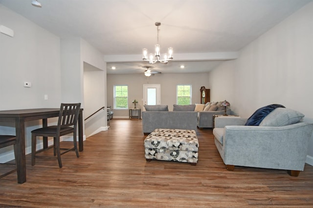 living room with an inviting chandelier and dark hardwood / wood-style flooring