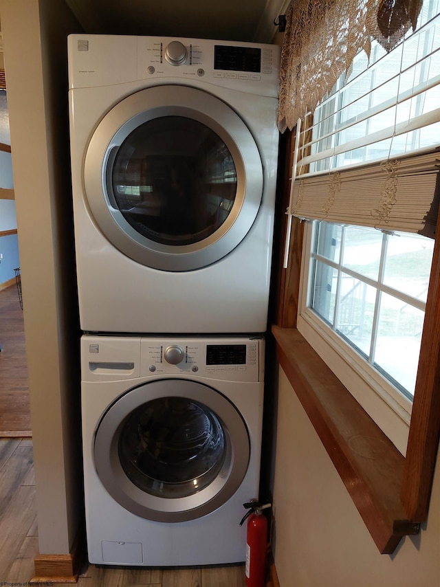 laundry room with stacked washer and clothes dryer