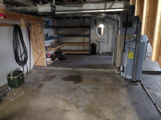 basement with sink and gas water heater