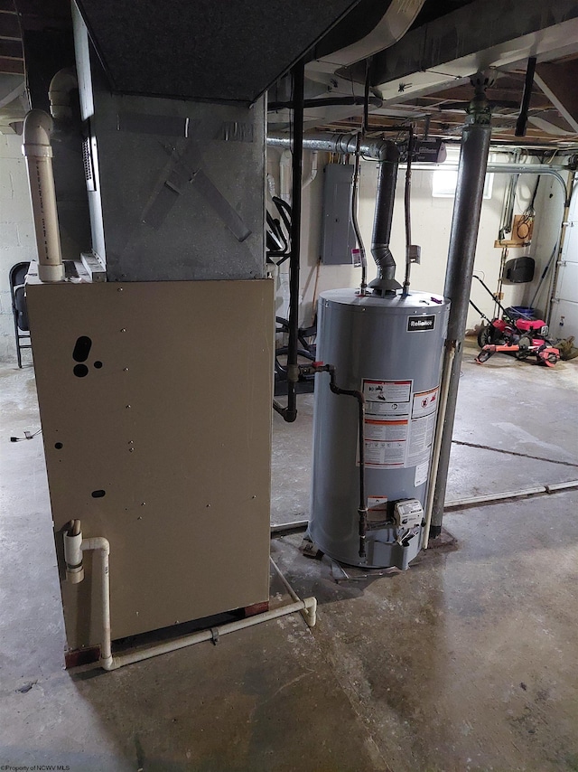 utility room with heating unit, gas water heater, and electric panel