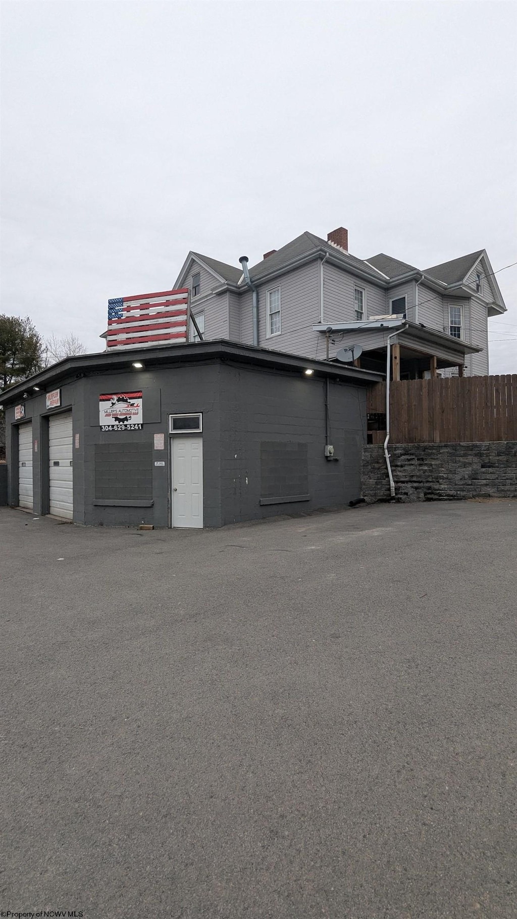 view of side of property with a garage