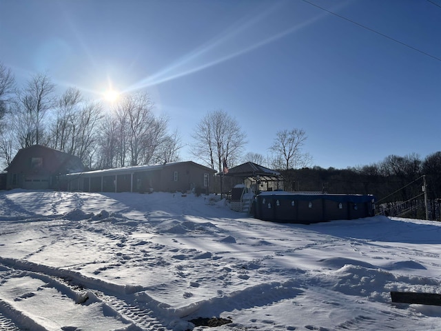 snowy yard featuring a gazebo