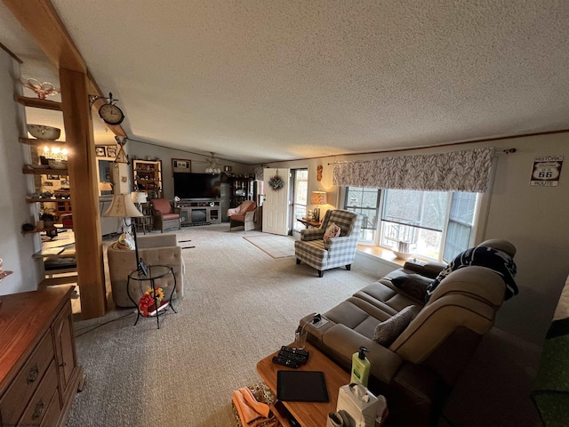 living room featuring vaulted ceiling, carpet, and a textured ceiling