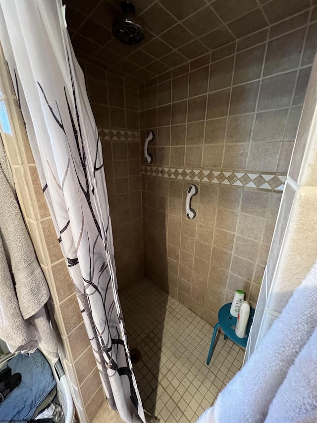 bathroom with tile patterned flooring and a shower with shower curtain