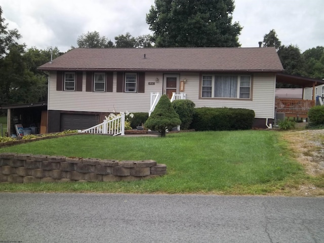 view of front of property featuring a garage and a front lawn