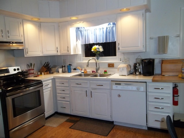 kitchen with stainless steel electric stove, tasteful backsplash, sink, white cabinets, and white dishwasher