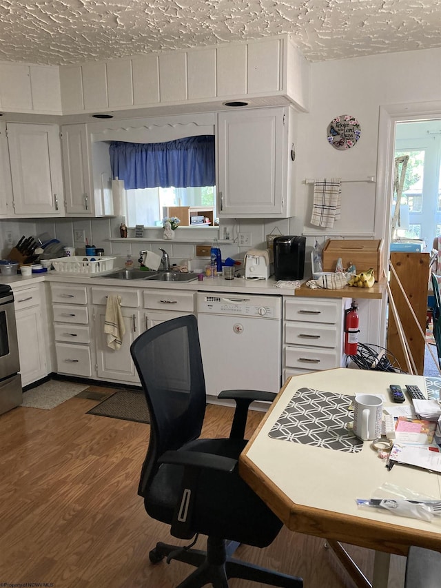 kitchen featuring sink, dark wood-type flooring, dishwasher, white cabinetry, and a textured ceiling