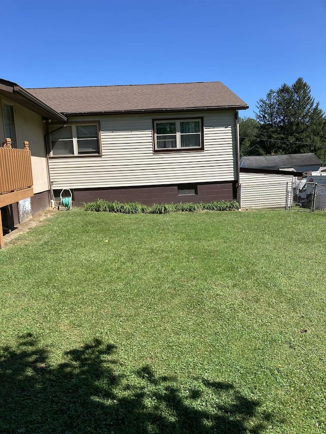 view of home's exterior with a yard