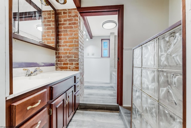 bathroom with hardwood / wood-style flooring and vanity