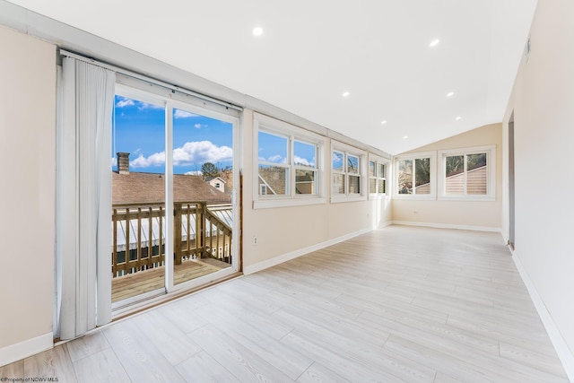 unfurnished sunroom with lofted ceiling