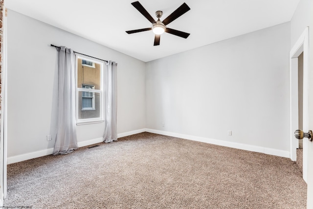 empty room with carpet flooring and ceiling fan