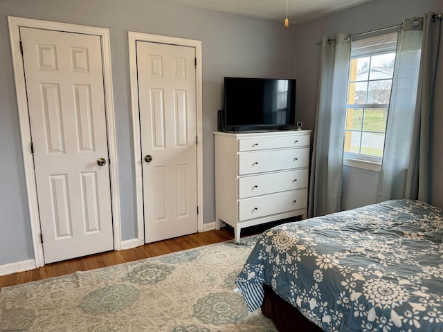 bedroom with hardwood / wood-style flooring