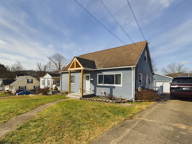 bungalow-style house with a garage and a front lawn