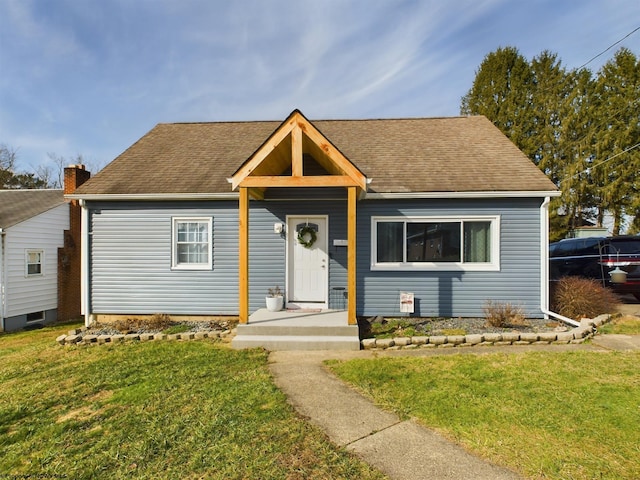 view of front of home with a front yard