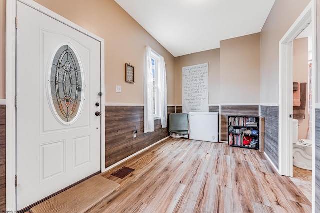 foyer entrance with light hardwood / wood-style flooring