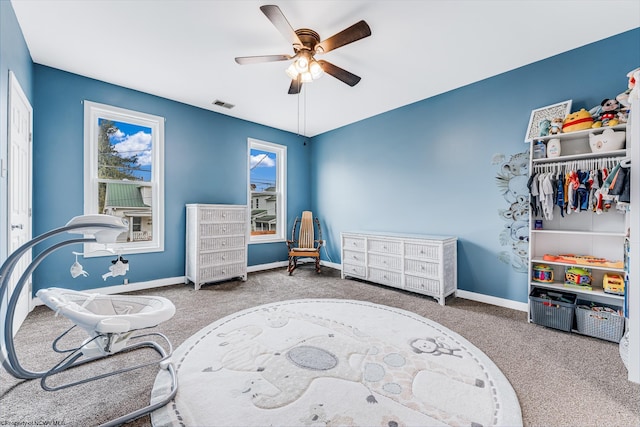 interior space featuring ceiling fan and carpet floors