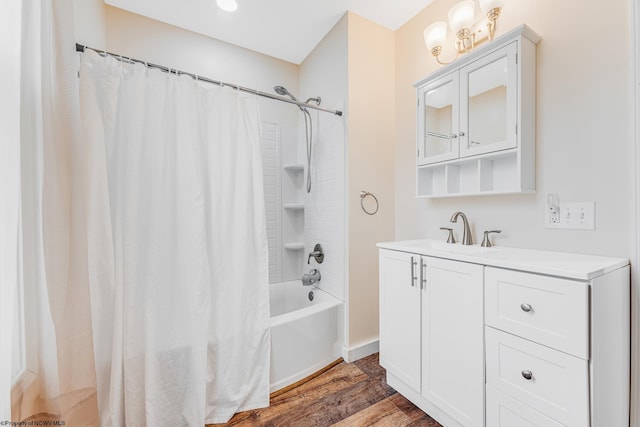 bathroom with vanity, hardwood / wood-style floors, and shower / bath combo