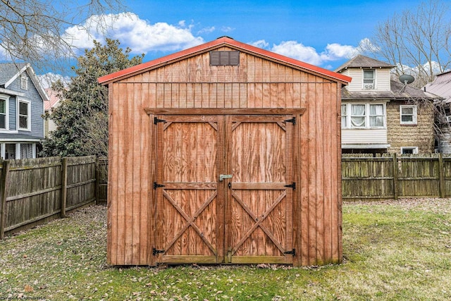 view of outdoor structure with a lawn