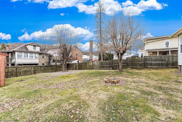 view of yard with an outdoor fire pit