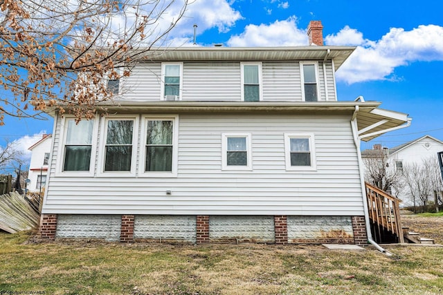 view of home's exterior with a yard