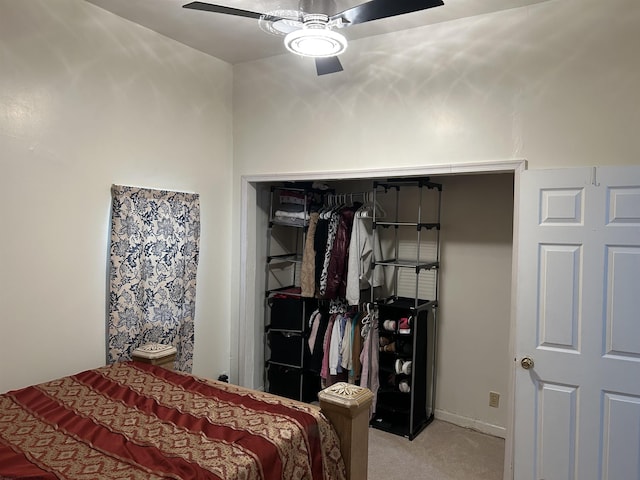 carpeted bedroom with a closet and ceiling fan