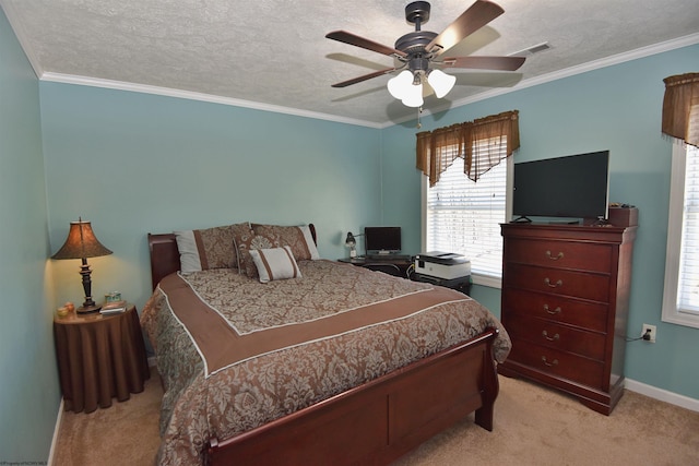 carpeted bedroom featuring ceiling fan, ornamental molding, and a textured ceiling