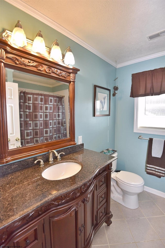 bathroom featuring tile patterned flooring, vanity, ornamental molding, a textured ceiling, and toilet