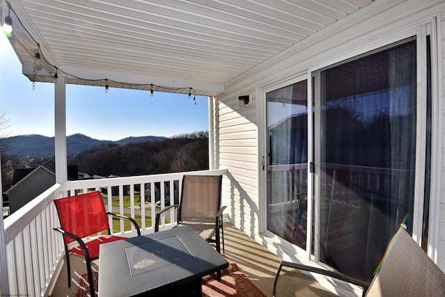 balcony featuring a mountain view