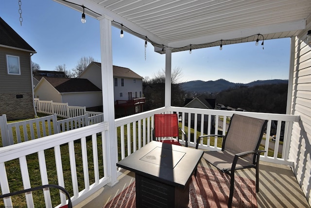 wooden terrace with a mountain view