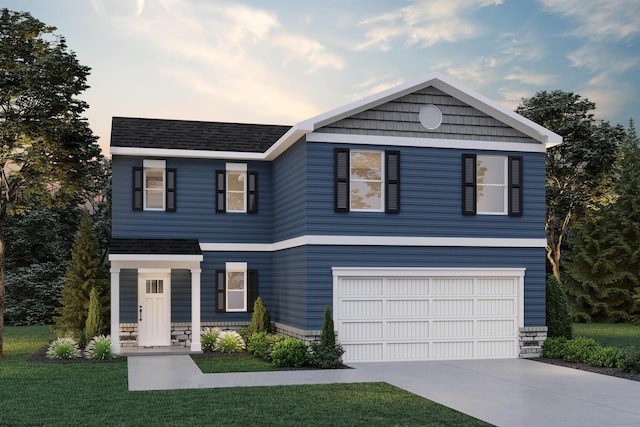 view of front of house featuring a garage and a lawn