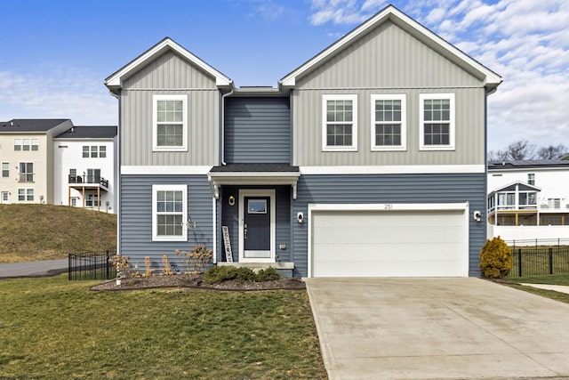 view of front of property featuring a garage and a front yard