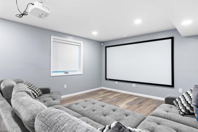 home theater room with hardwood / wood-style floors