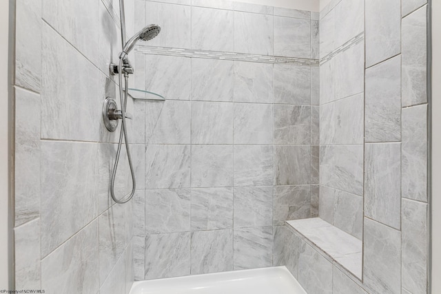 bathroom featuring tiled shower