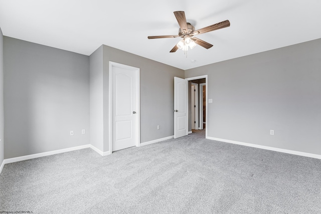 unfurnished bedroom with light colored carpet and ceiling fan