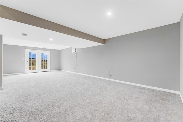 unfurnished room featuring carpet and french doors