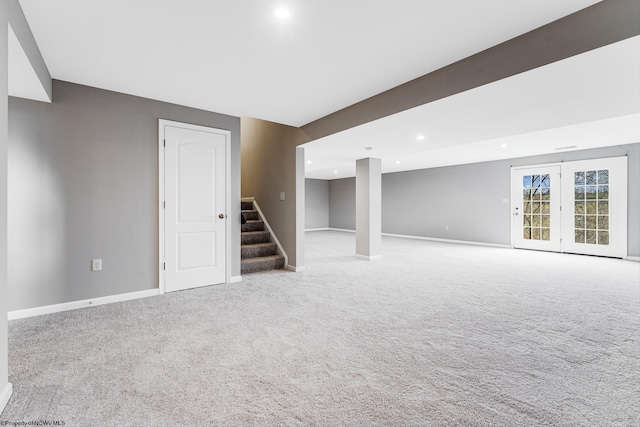 basement featuring light colored carpet