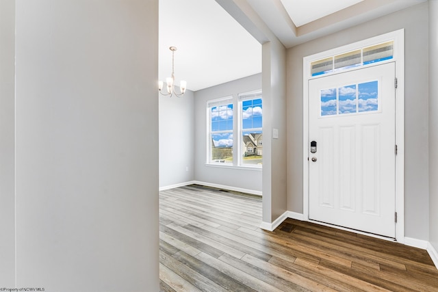 entrance foyer with an inviting chandelier and light wood-type flooring