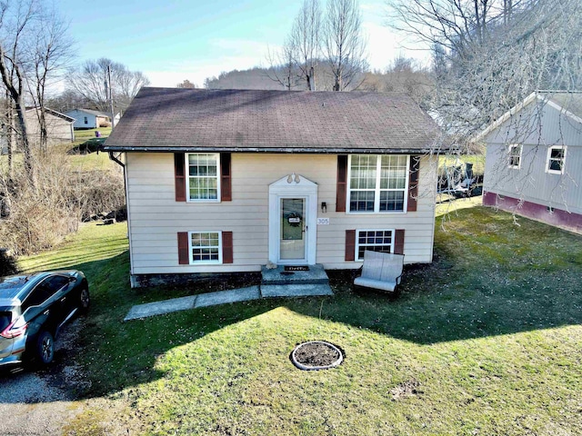 raised ranch with a front lawn