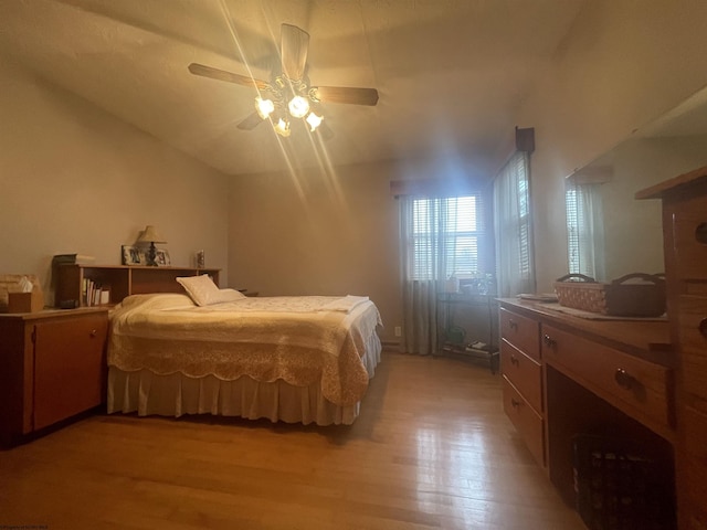 bedroom featuring ceiling fan and light hardwood / wood-style flooring