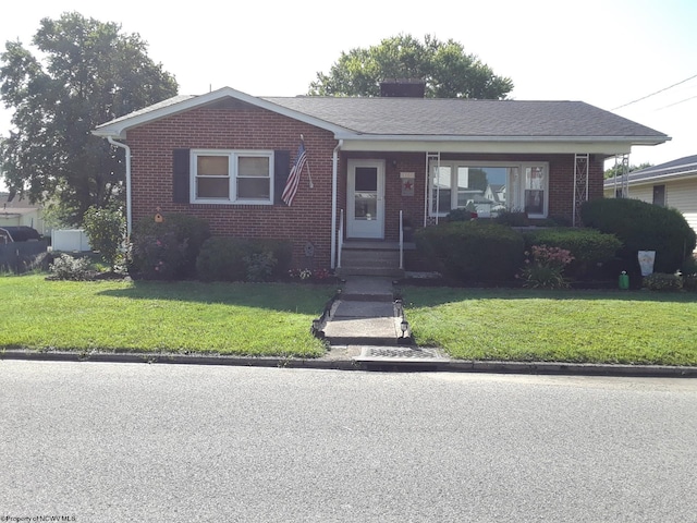 bungalow-style home featuring a front yard