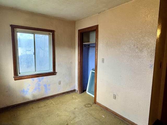 unfurnished bedroom featuring light carpet