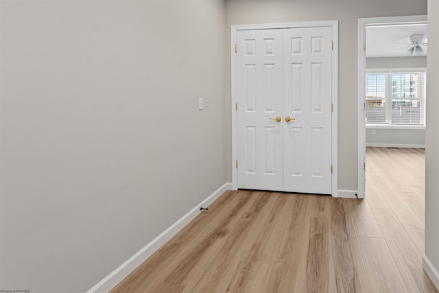 hallway with light wood-type flooring