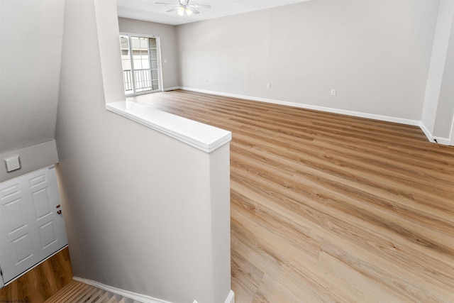 spare room with ceiling fan and hardwood / wood-style floors