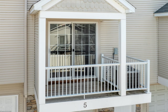 entrance to property featuring a balcony