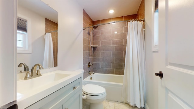 full bathroom featuring shower / tub combo with curtain, vanity, and toilet