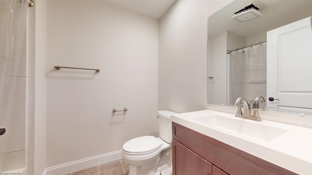 bathroom featuring walk in shower, tile patterned floors, vanity, and toilet