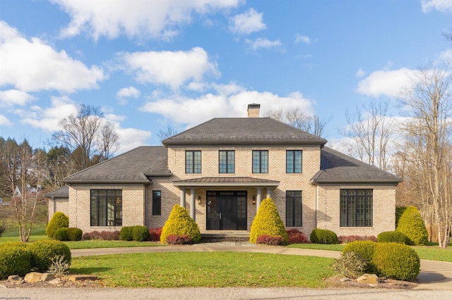 view of front of property with a porch and a front yard