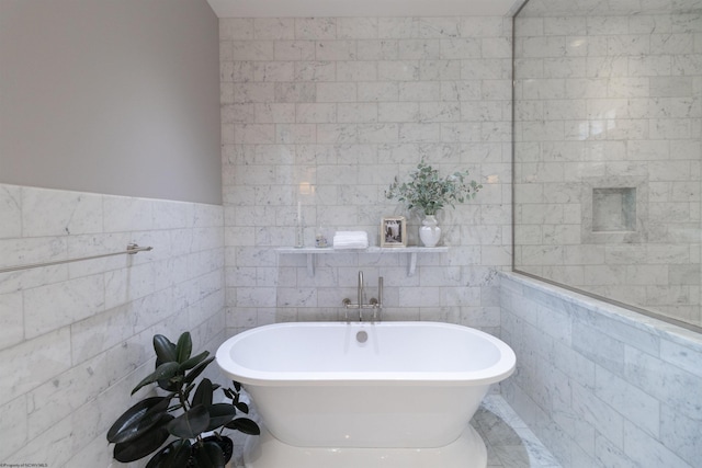 bathroom featuring tile walls and a bathtub