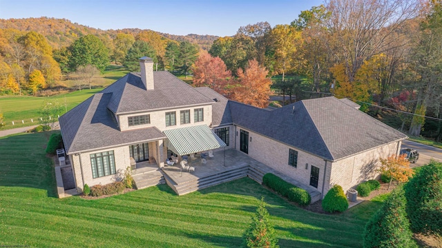 birds eye view of property featuring a mountain view