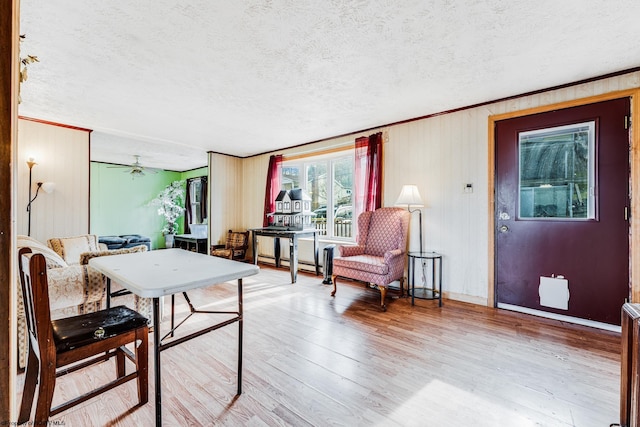 interior space featuring light hardwood / wood-style floors and a textured ceiling